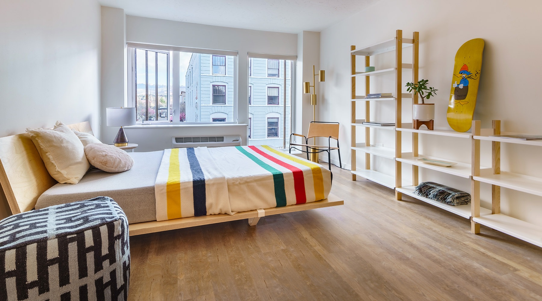 open style layout bedroom with large windows